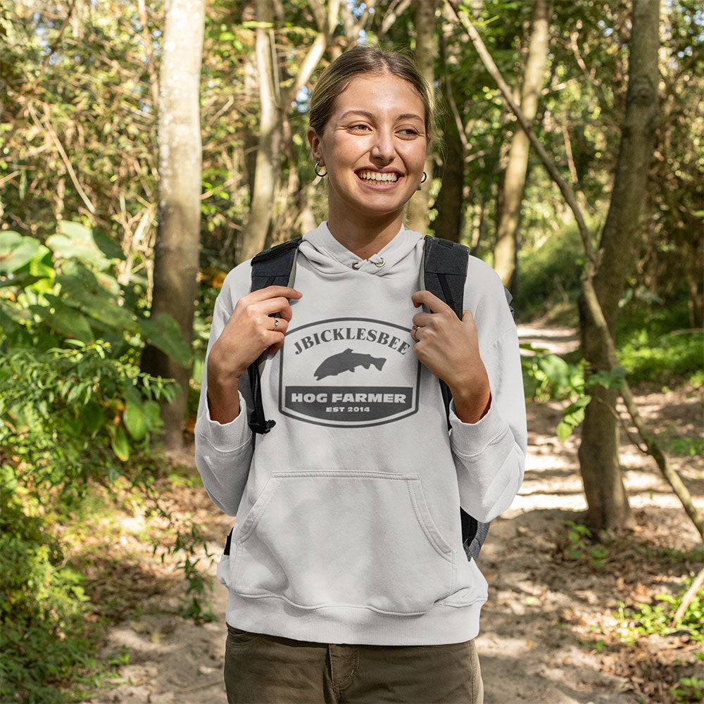 woman wearing Retro Hog Farmer Trout Fishing Hoodie in the woods