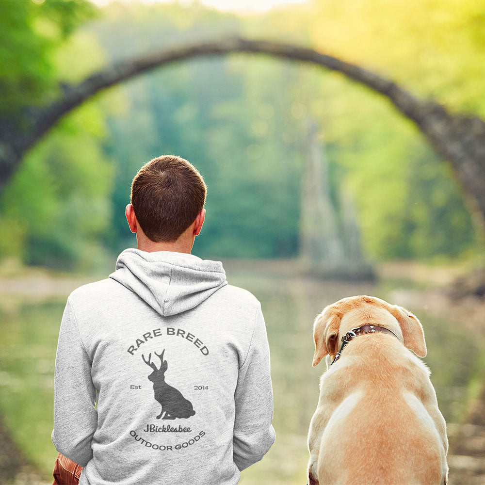 man with dog wearing Rare Breed Jackalope Hoodie