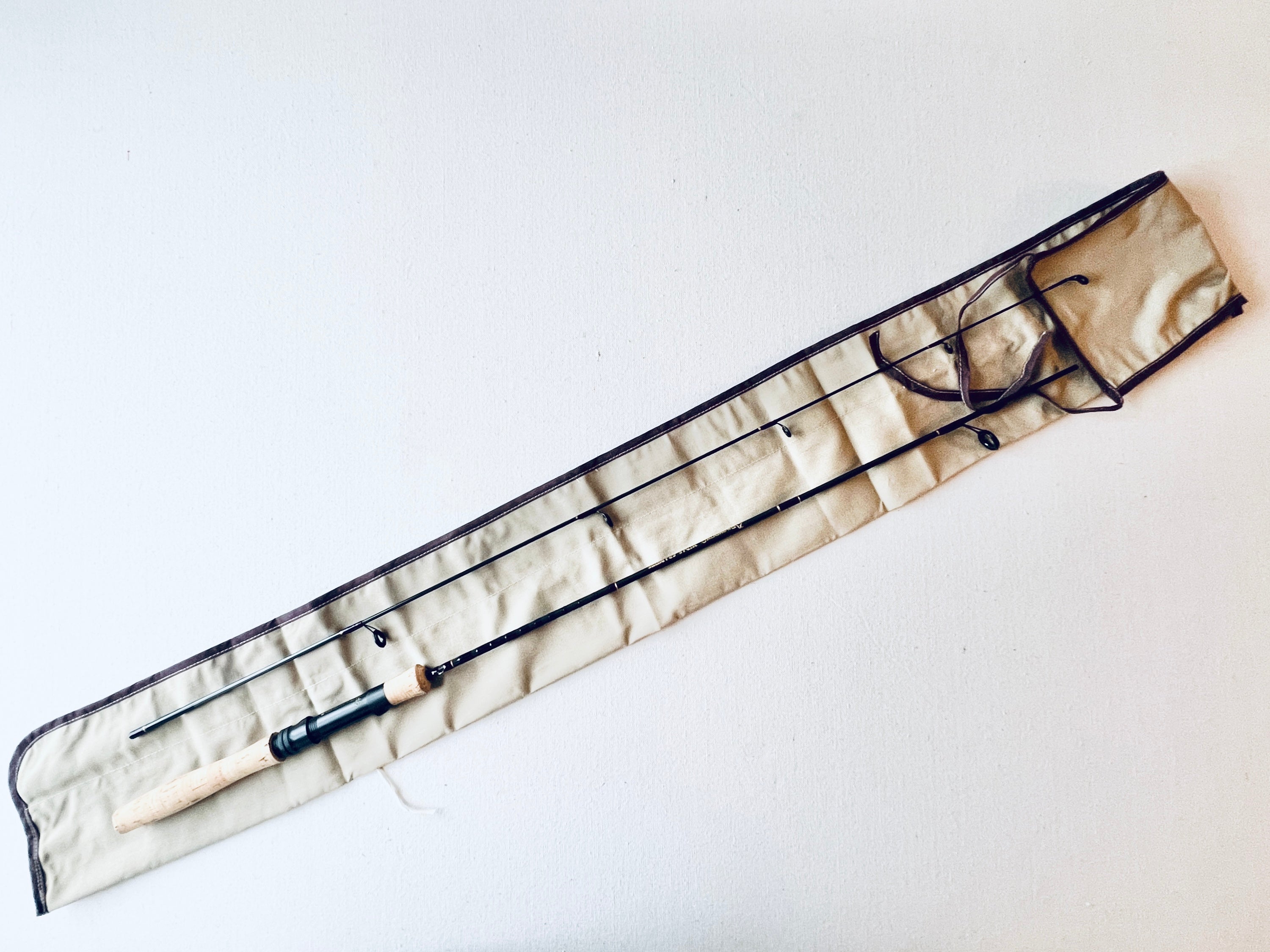 Full length view of Vintage Browning Spinning Rod Model 732955 with protective rod sleeve