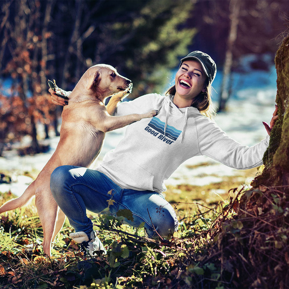 Woman playing with a dog in a forested area