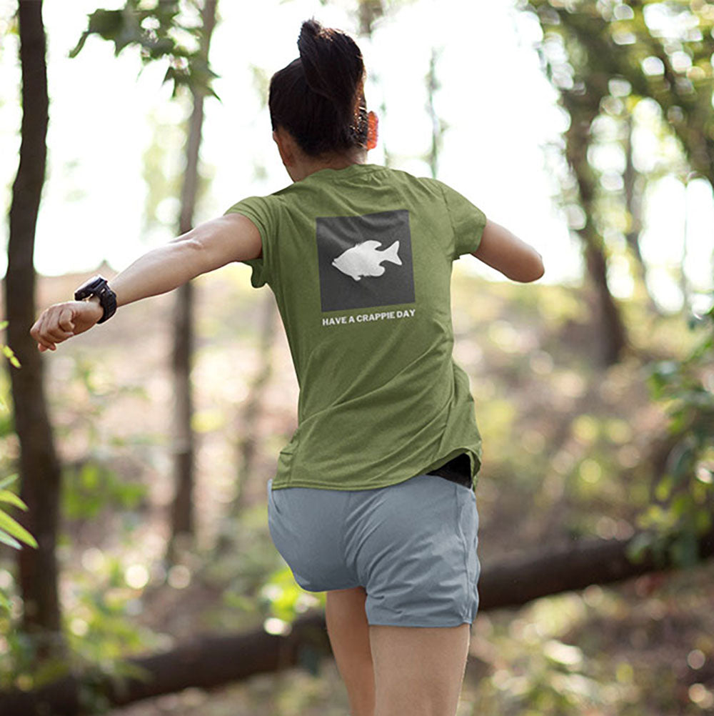 woman running in the woods wearing a JBicklesbee Have a Crappie Day tshirt