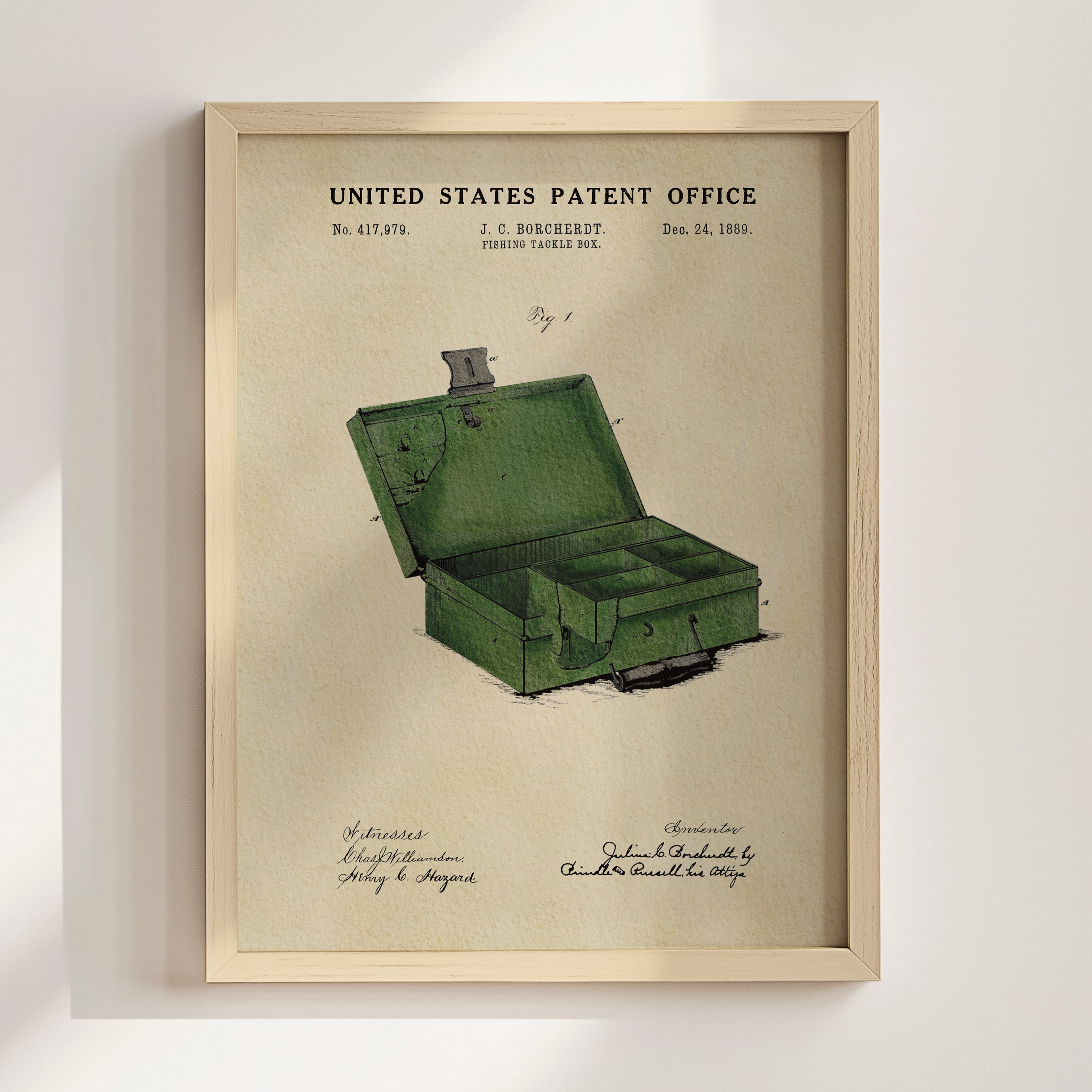 Historic fishing tackle box patent art displayed in a natural wood frame.