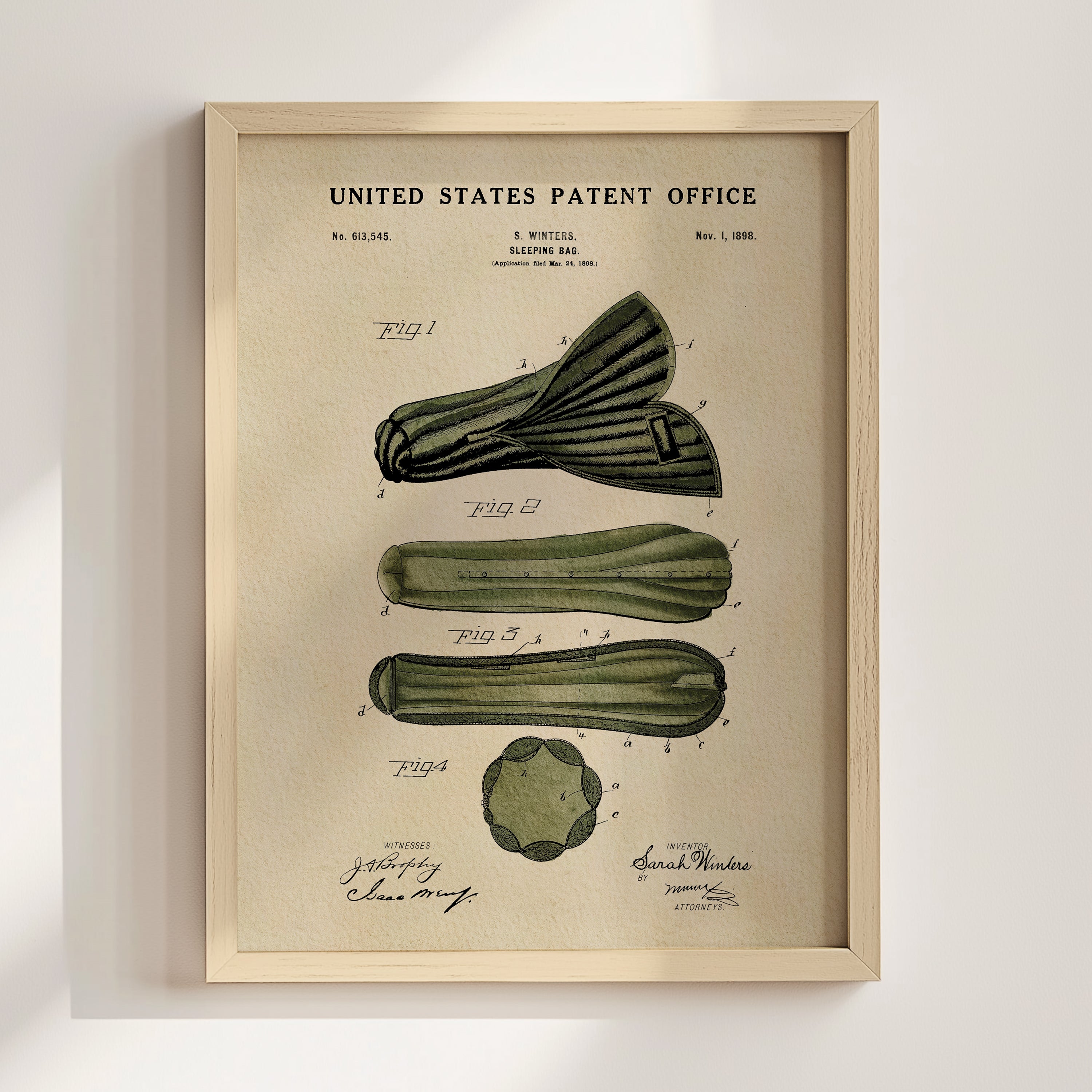 Historic Sleeping Bag patent art displayed in a natural wood frame.