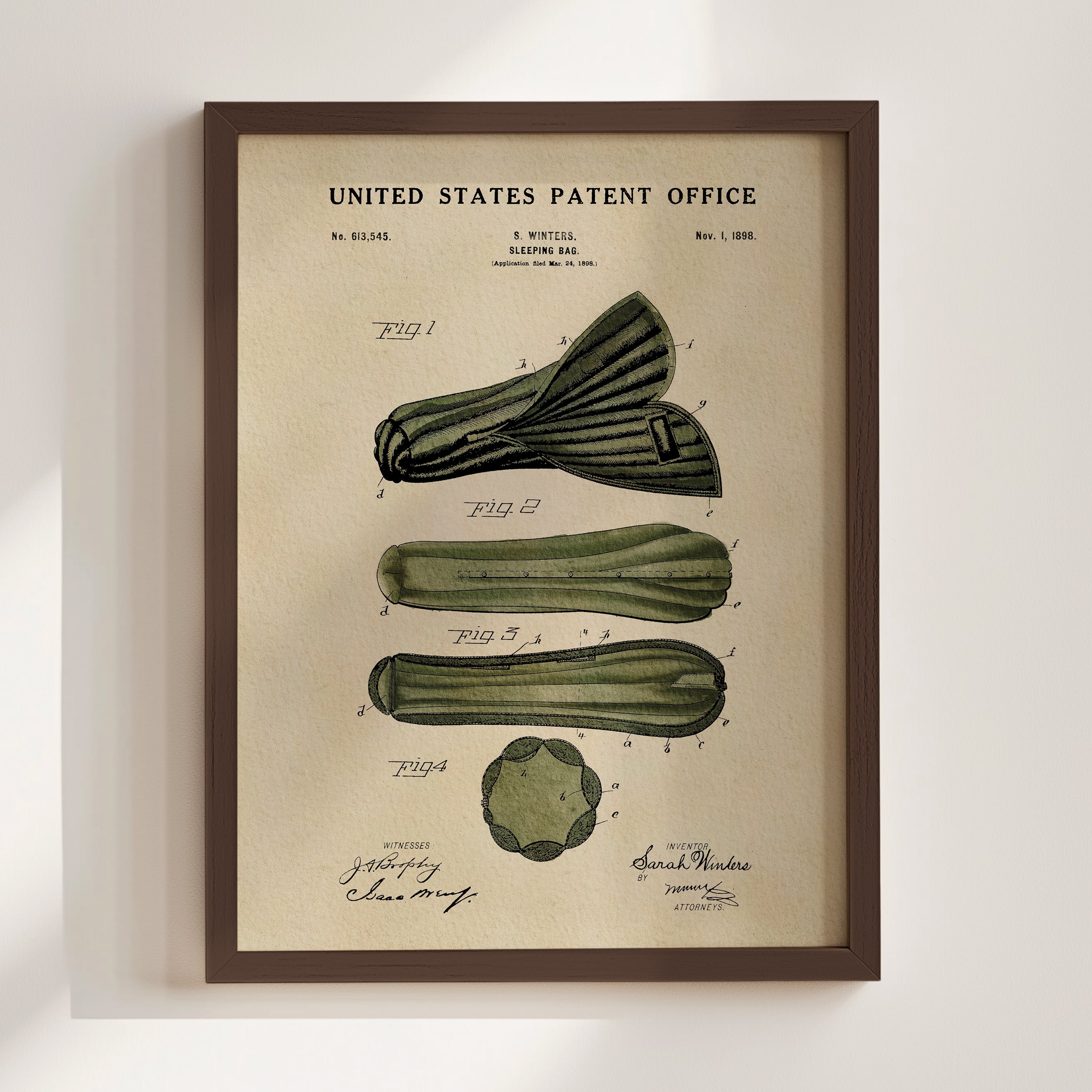 Sarah Winters 1898 Sleeping Bag patent print displayed in a walnut frame.