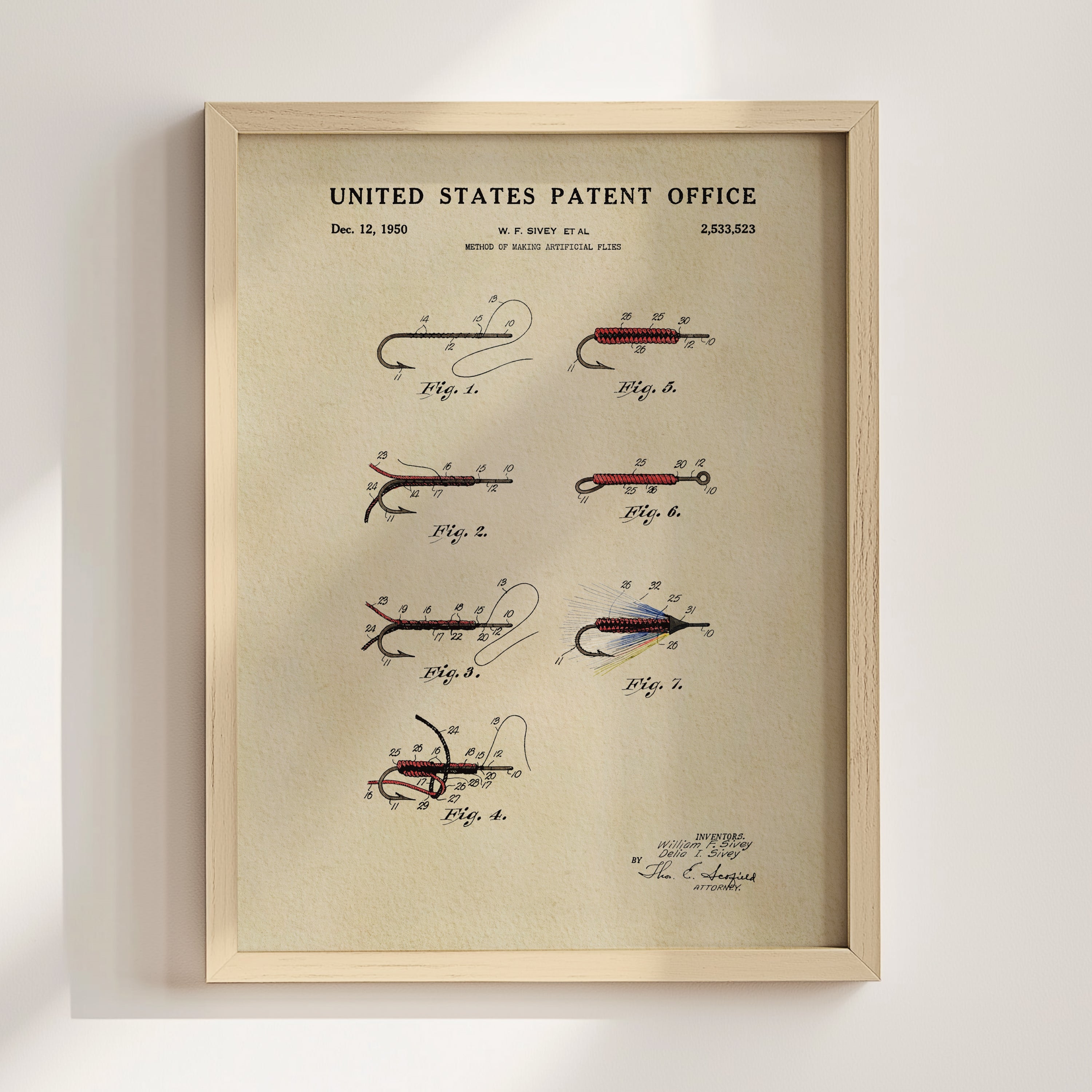 1950 fly fishing patent art displayed in a natural wood frame.
