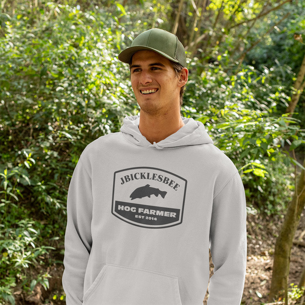man wearing Retro Hog Farmer Trout Fishing Hoodie in the woods