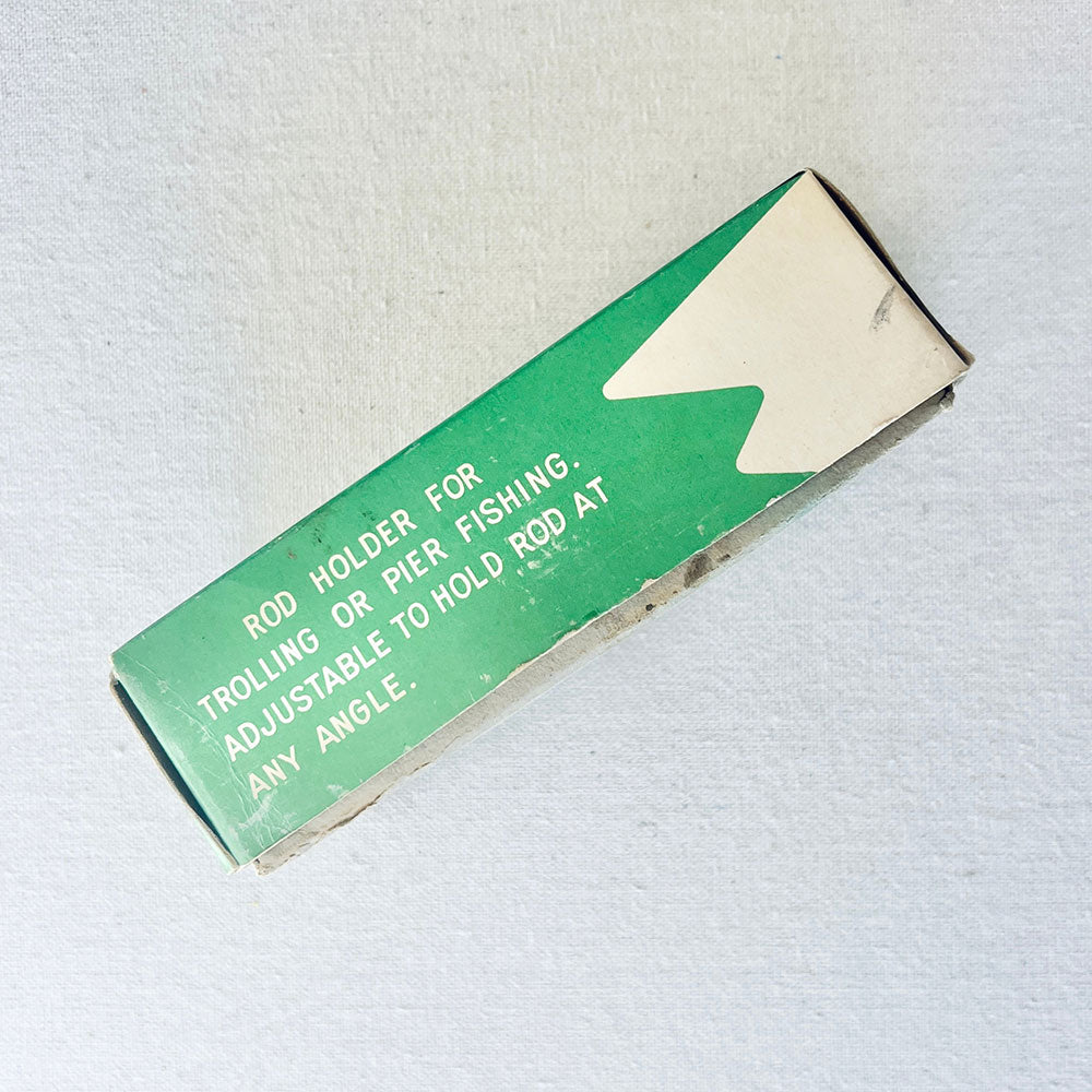 Original Sears Roebuck rod holder box showing adjustable trolling and pier fishing instructions on vintage packaging.