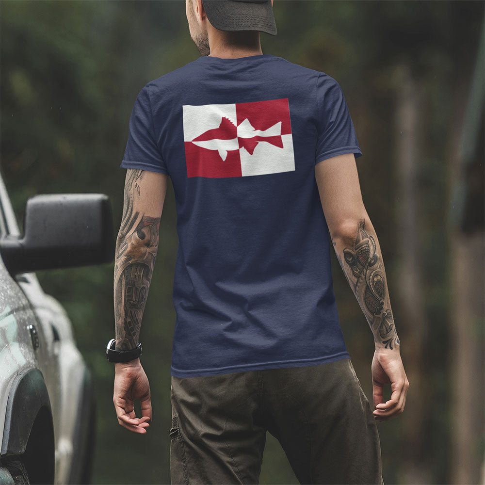 back view of a man wearing Quadrant Striper Striped Bass T-shirt near a truck