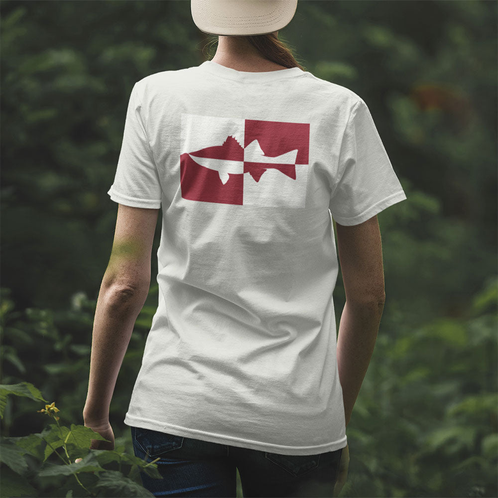 back view of woman wearing Quadrant Striper Striped Bass T-shirt in the woods