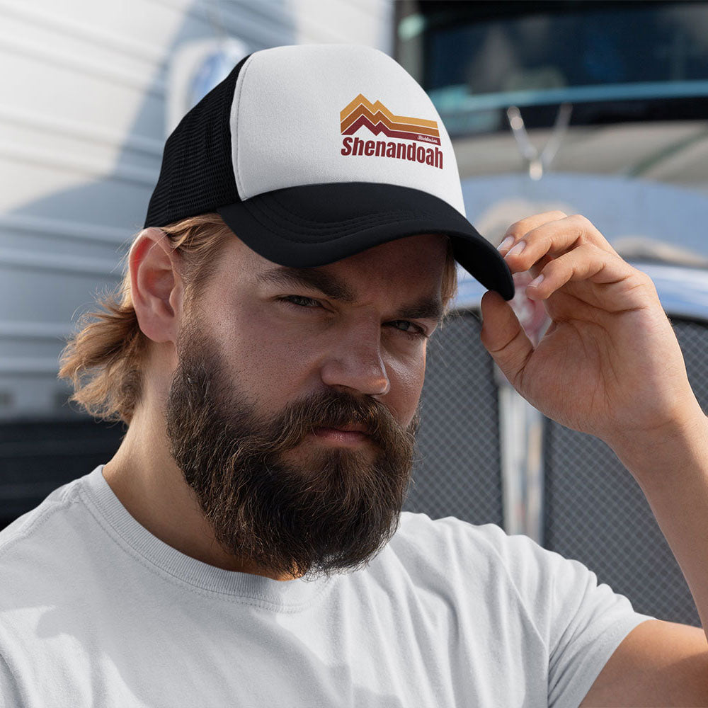 bearded man with Retro Shenandoah Trucker Hat on in front of truck