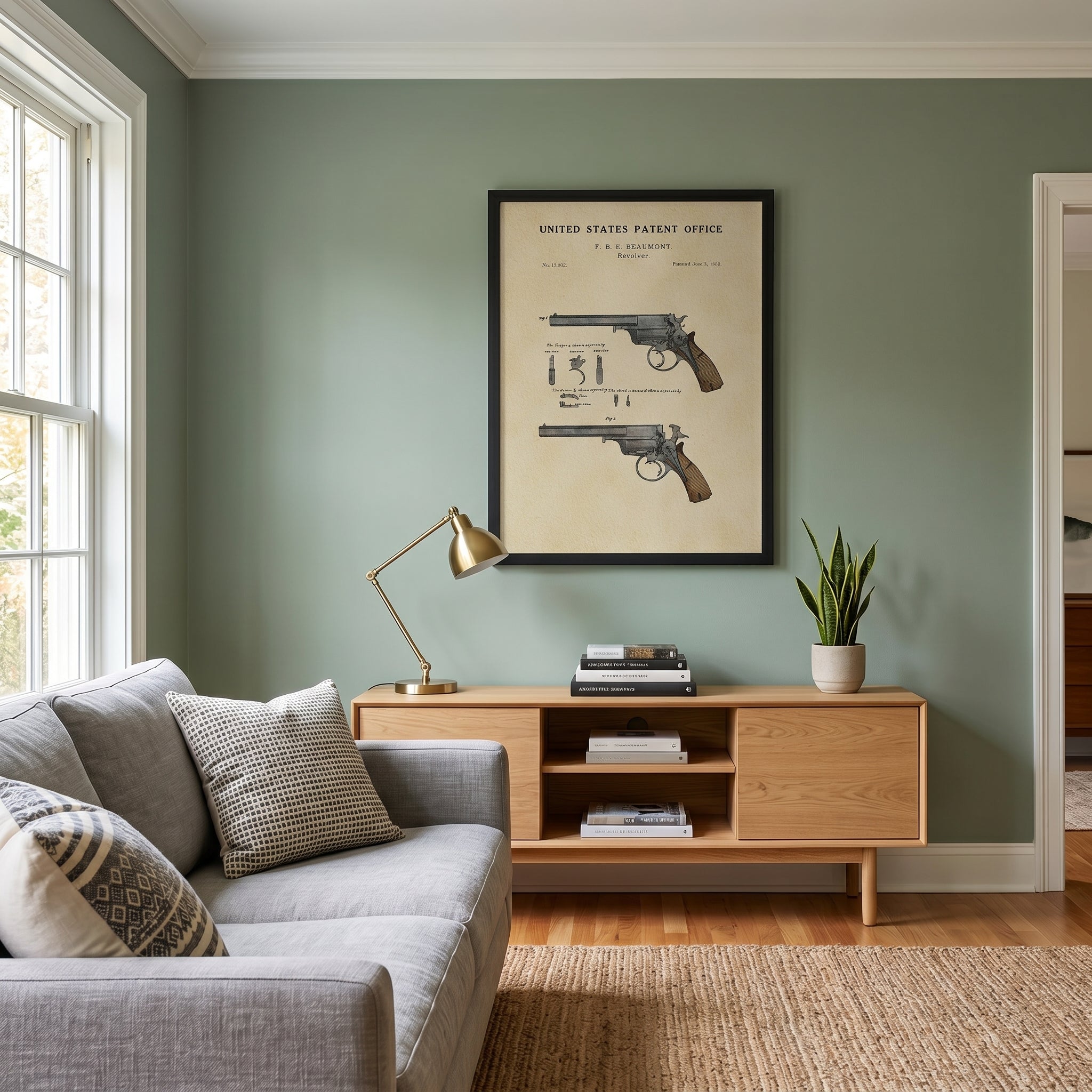 Vintage Beaumont Revolver patent print displayed in a gun room or study