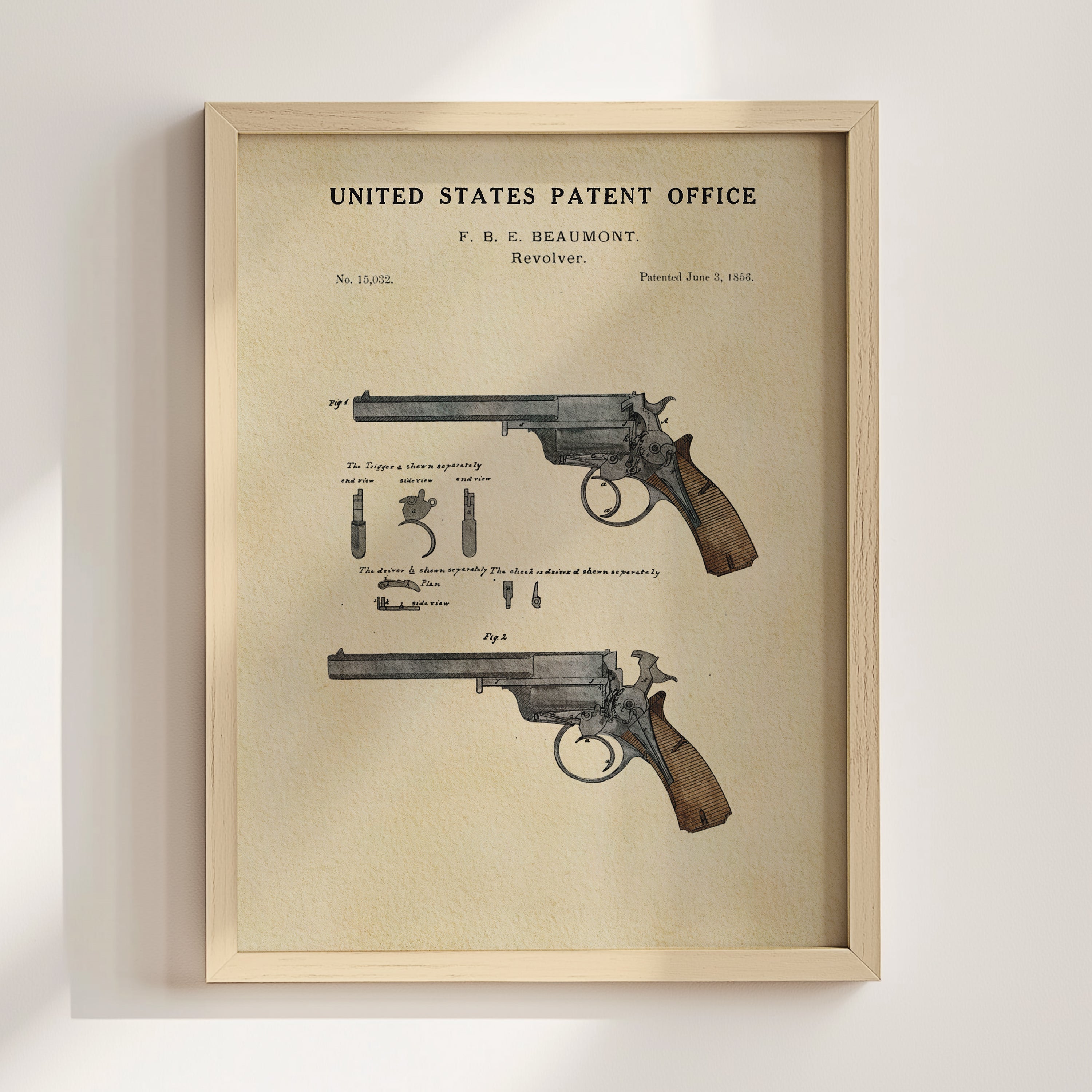 Beaumont Revolver patent print displayed in a natural wood frame