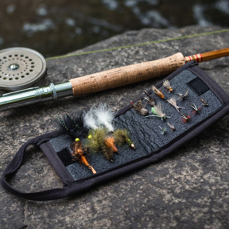 Duluth Pack Bi-Fold Fly Wallet holding assorted fishing flies