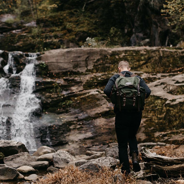 Duluth Pack Wanderer 24L Canvas Hiking Backpack worn on the trail during a hike