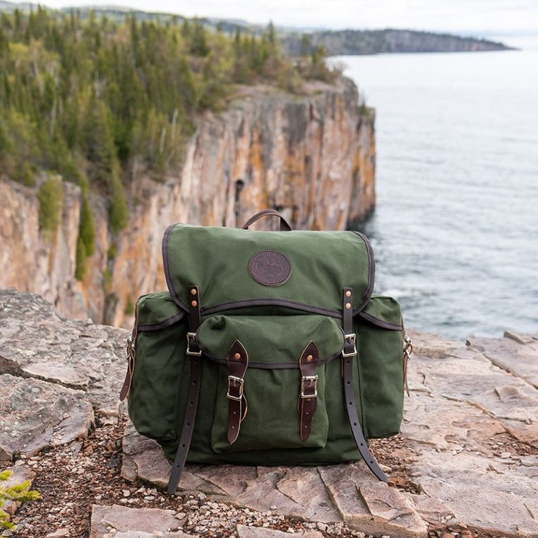 Duluth Pack Wanderer 24L Canvas Hiking Backpack in a natural outdoor setting