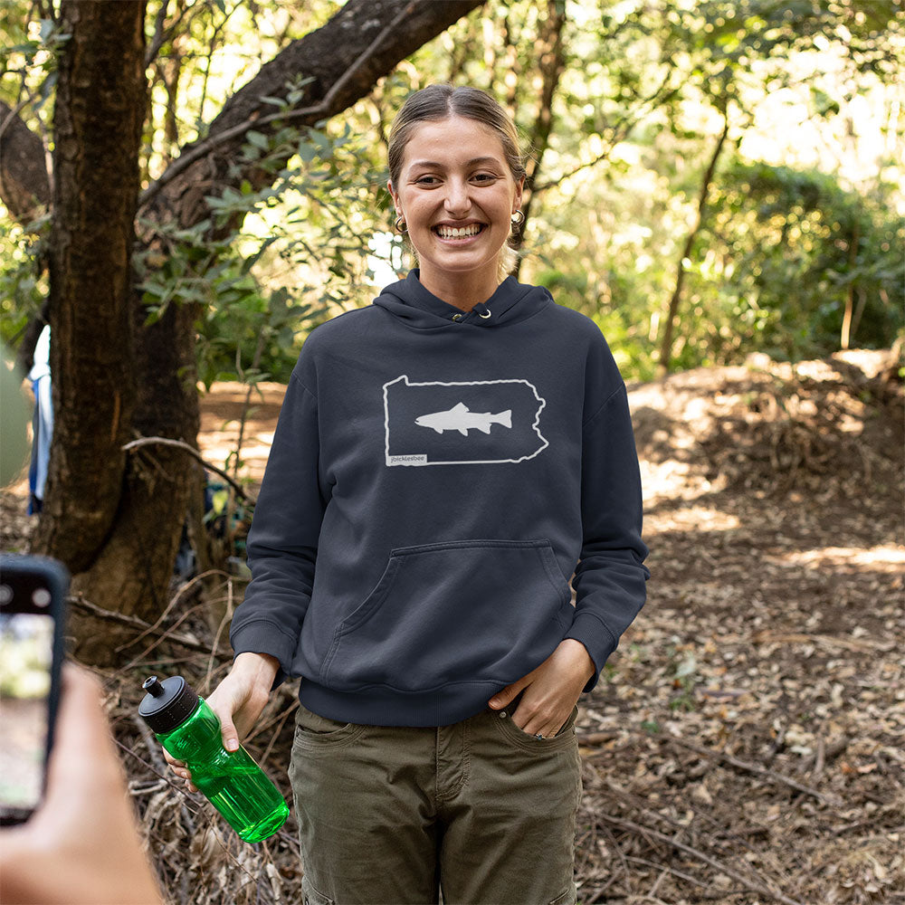 woman wearing Keystone State Trout Fishing Hoodie in the woods
