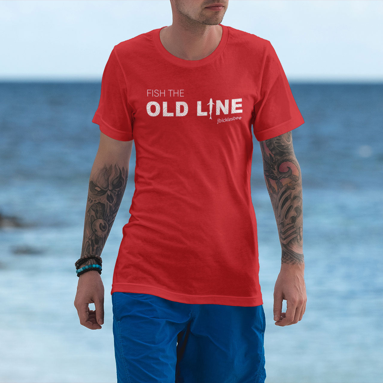 man wearing OLD LINE Maryland Fishing T-shirt on beach