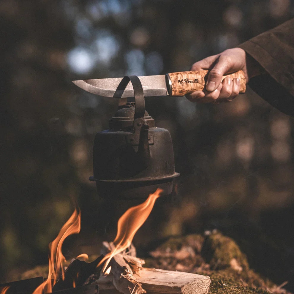 Roselli Long Hunting Knife being used outdoors for hunting, bushcraft, and camp tasks