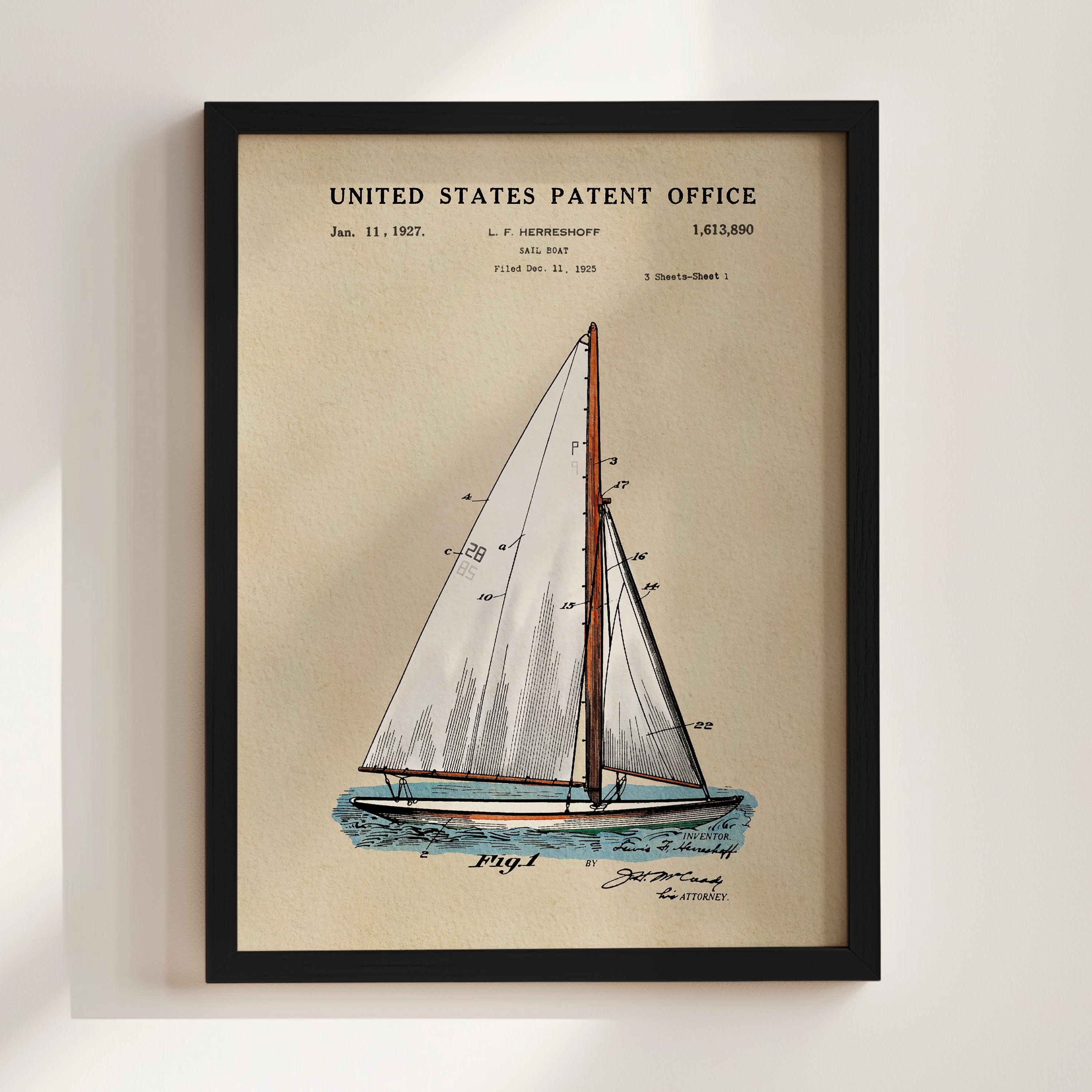 Sailboat patent print displayed in a black frame