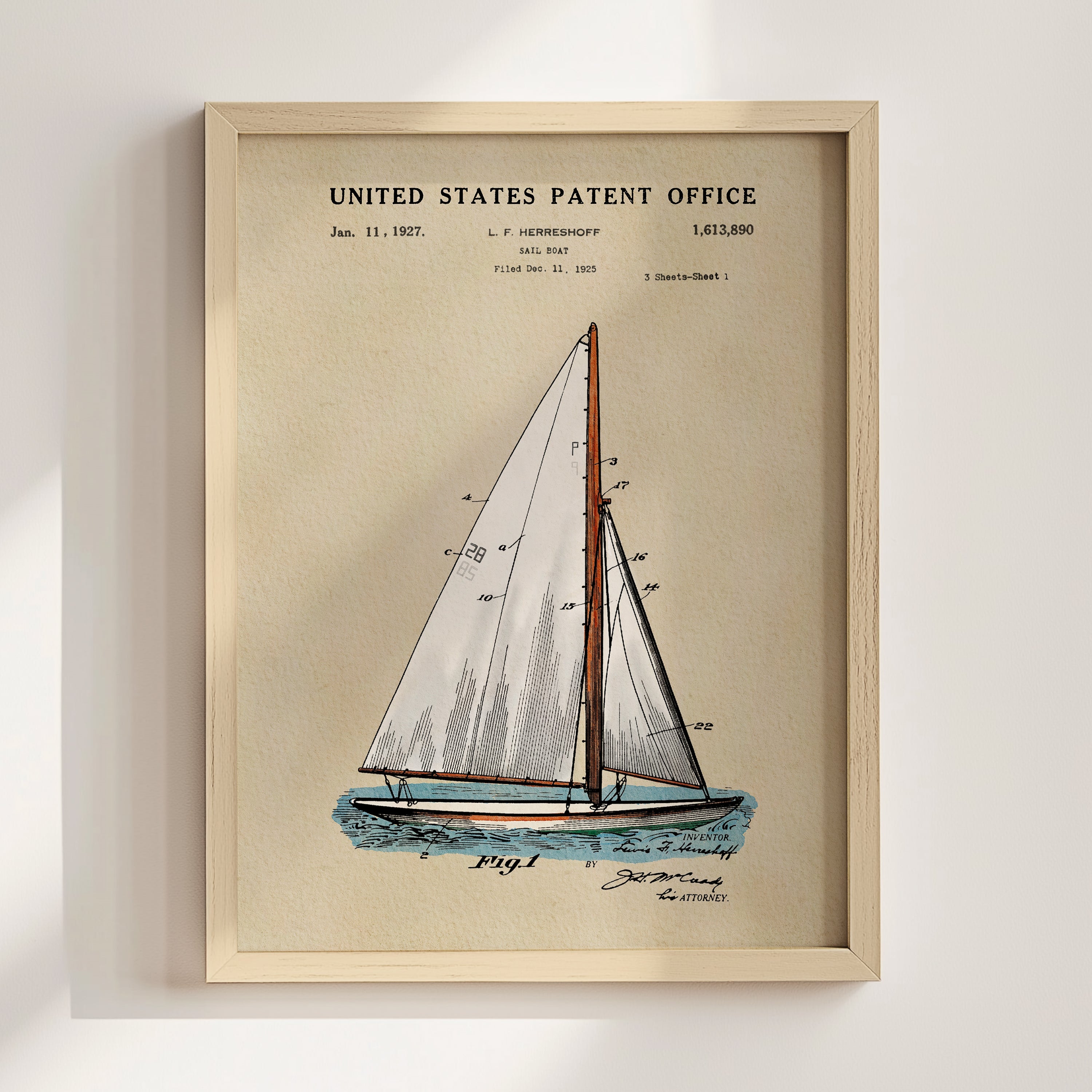Sailboat patent print displayed in a natural wood frame