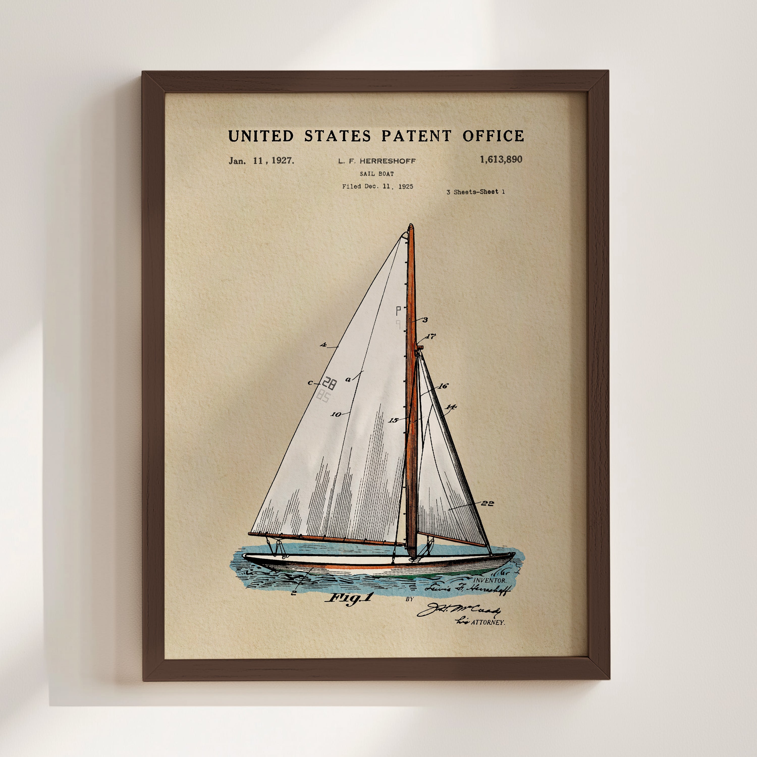 Sailboat patent print displayed in a walnut frame