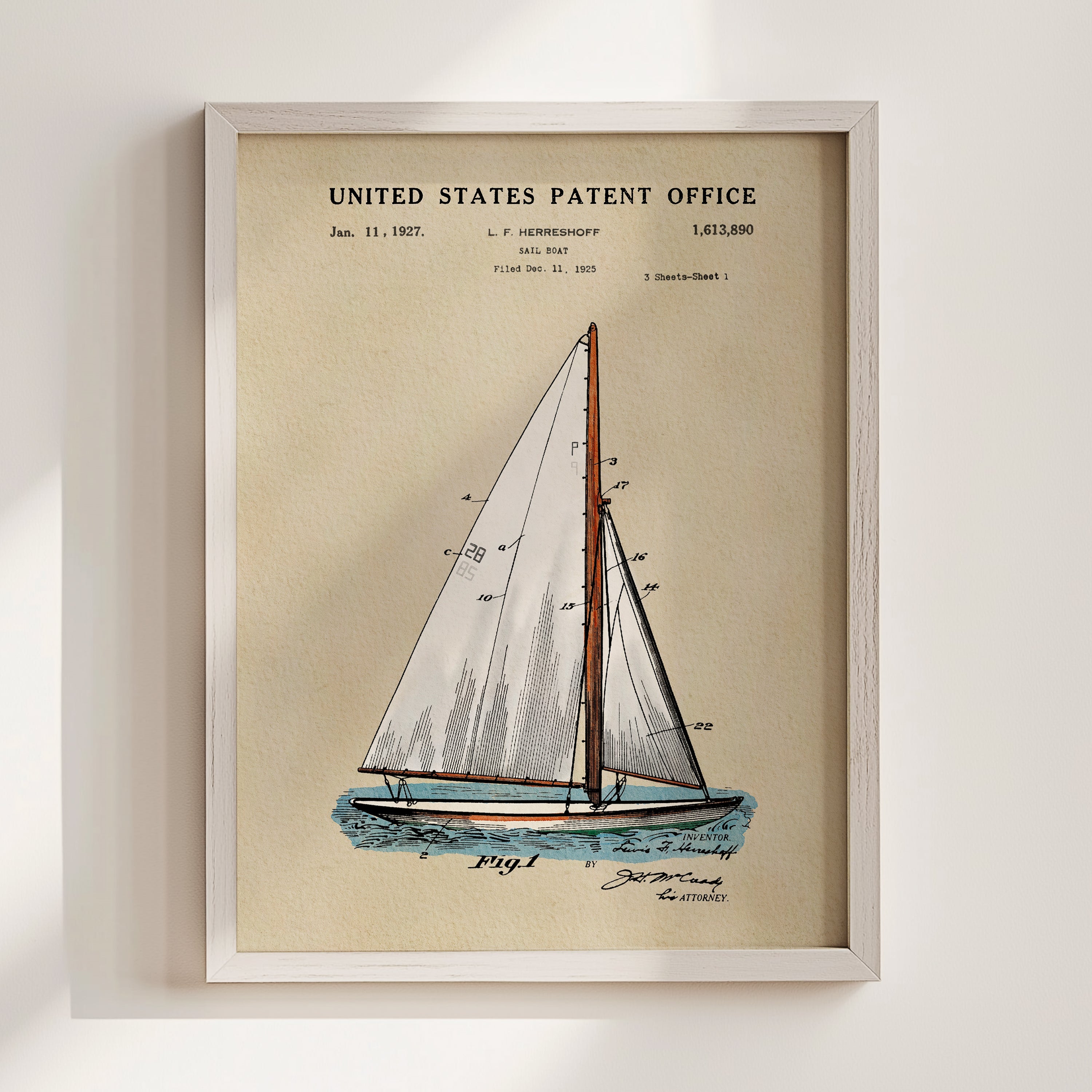 Sailboat patent print displayed in a white frame