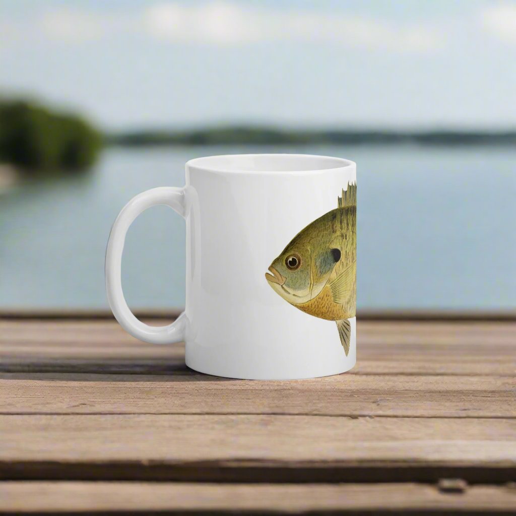 coffee mug with bluegill design on a table