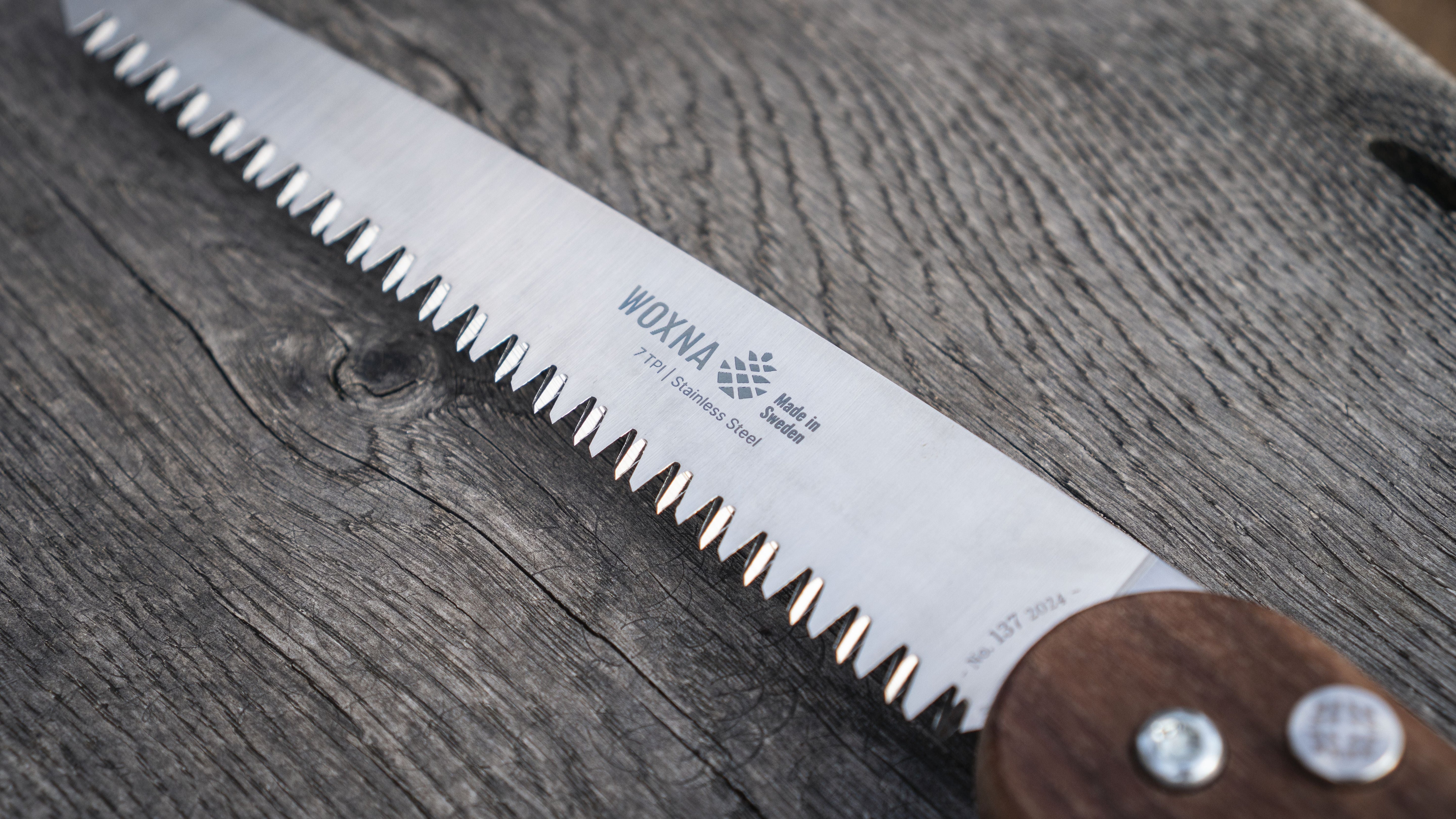 Close-up of the Woxna Ljusnan 7-inch foldable saw blade and teeth in stainless steel